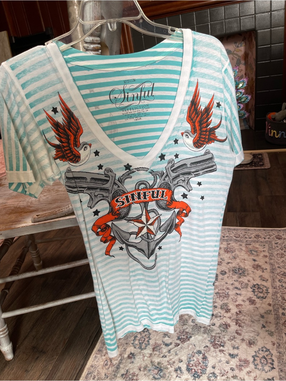 Sinful Aqua and White Striped V-Neck Graphic Tee with Orange Accents